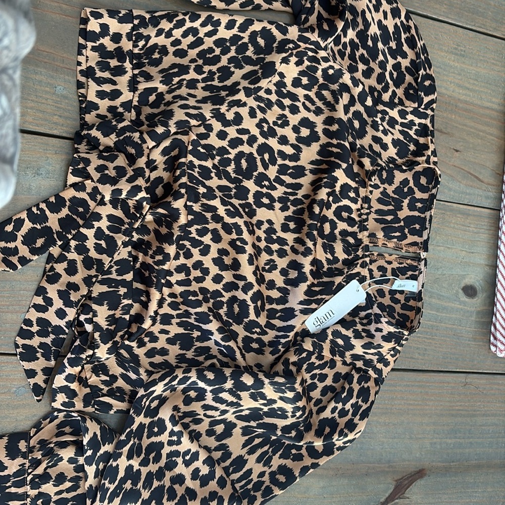 This is a cheetah print shirt from a boutique.🐆